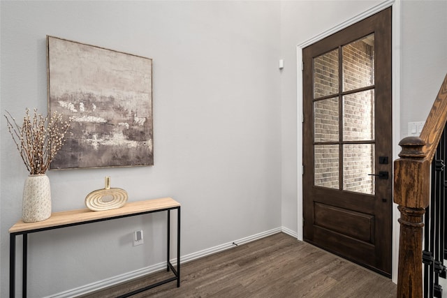 entrance foyer with a healthy amount of sunlight and dark hardwood / wood-style floors