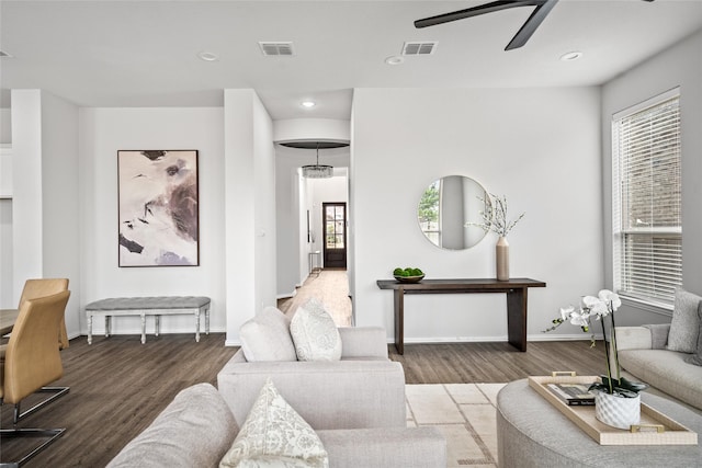 living room with hardwood / wood-style flooring and ceiling fan