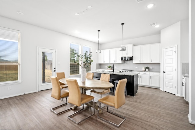 dining area featuring wood-type flooring