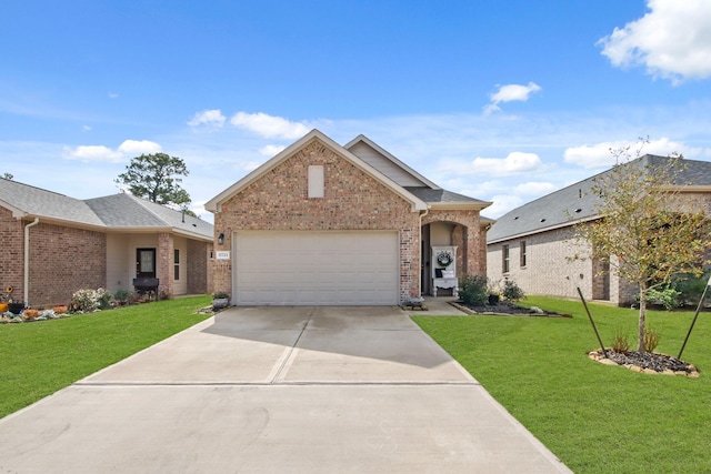 view of front of house with a garage and a front lawn