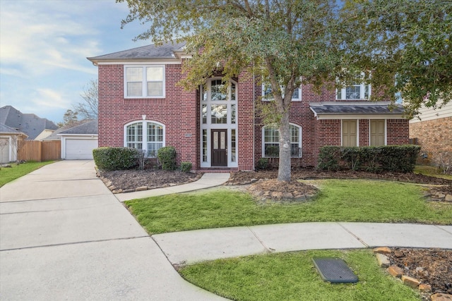 view of front of home featuring a front lawn and a garage