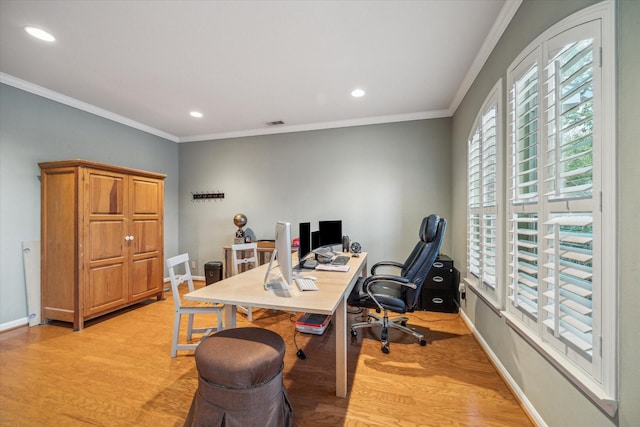 office area with light hardwood / wood-style flooring and crown molding