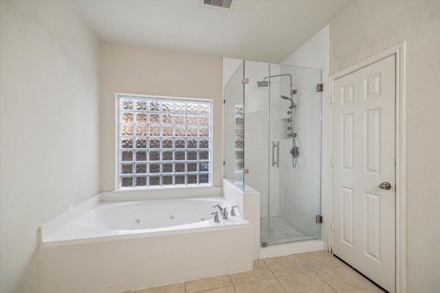 bathroom with plus walk in shower and tile patterned flooring