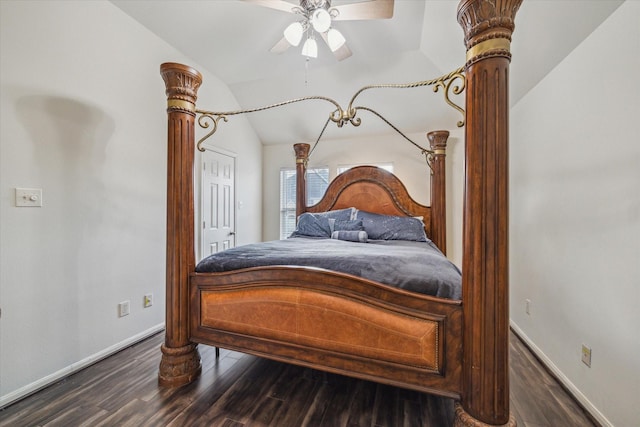 bedroom featuring lofted ceiling, dark hardwood / wood-style flooring, and decorative columns