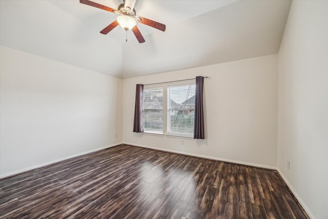 empty room featuring ceiling fan, lofted ceiling, and dark hardwood / wood-style flooring