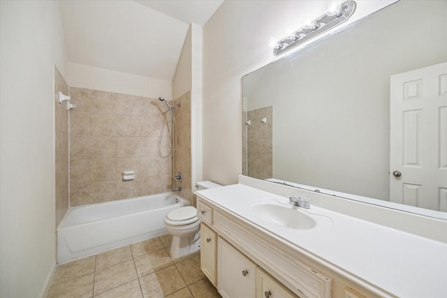 full bathroom with tile patterned floors, toilet, vanity, and tiled shower / bath combo