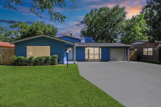 2713 John St, La Marque, TX 77568 - ranch-style house featuring fence, an attached garage, a front lawn, a chimney, and driveway