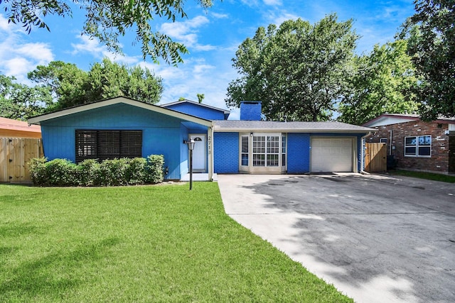 2713 John St, La Marque, TX 77568 - single story home featuring a chimney, a front yard, a garage, fence, and concrete driveway