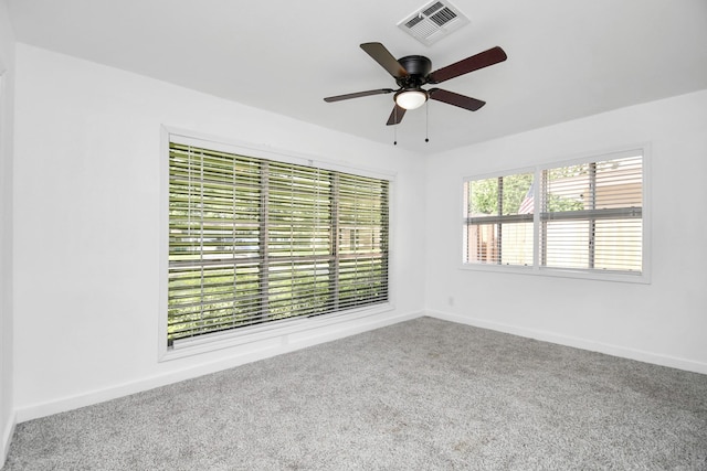 2713 John St, La Marque, TX 77568 - carpeted empty room with baseboards, visible vents, and ceiling fan