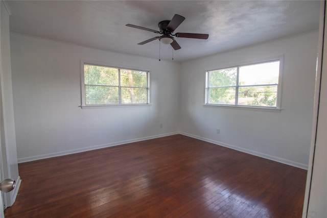 2713 John St, La Marque, TX 77568 - unfurnished room with crown molding, a ceiling fan, baseboards, and dark wood-style floors