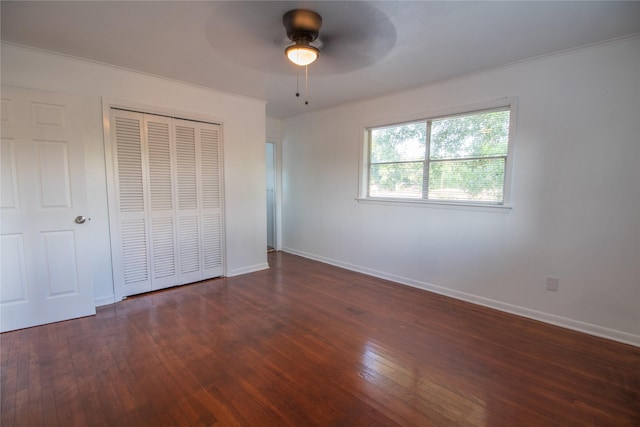 2713 John St, La Marque, TX 77568 - unfurnished bedroom featuring baseboards, a ceiling fan, a closet, and hardwood / wood-style floors