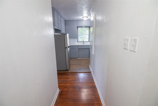 2713 John St, La Marque, TX 77568 - hall with dark wood-type flooring and baseboards