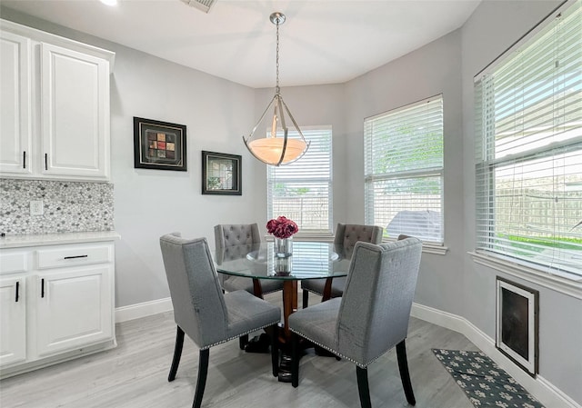 dining space featuring light hardwood / wood-style flooring