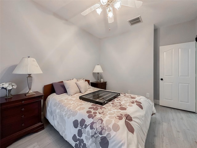 bedroom with ceiling fan and light wood-type flooring