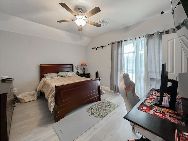 bedroom with lofted ceiling, light hardwood / wood-style floors, and ceiling fan