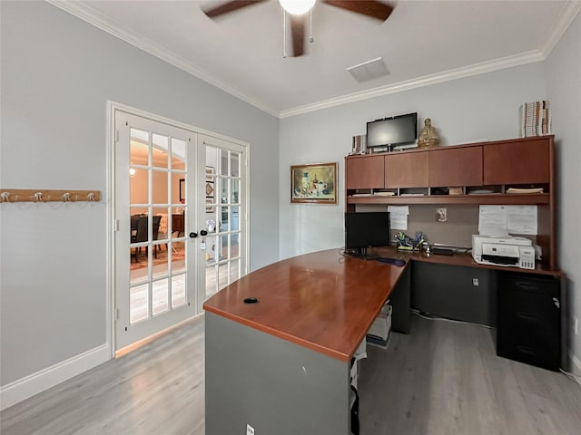 office space featuring crown molding, light hardwood / wood-style floors, french doors, and ceiling fan