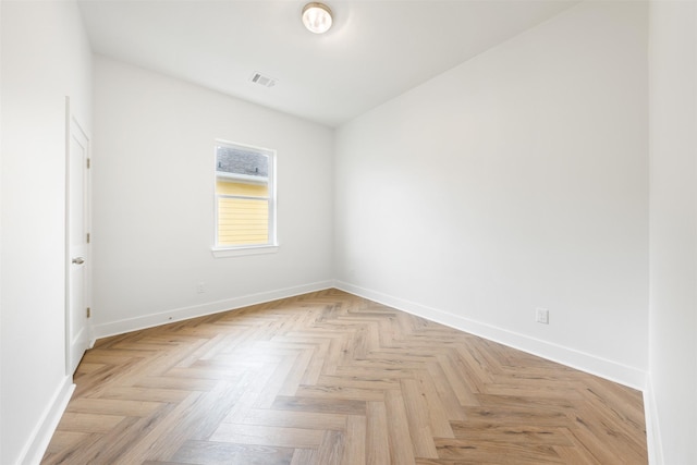 spare room featuring light parquet floors