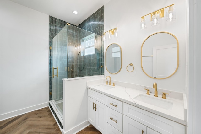 bathroom featuring vanity, parquet floors, and a shower with door