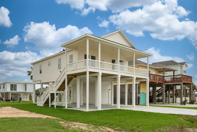 back of property featuring a yard, a carport, and covered porch