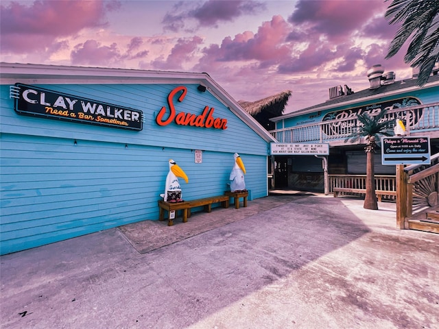 view of outdoor building at dusk