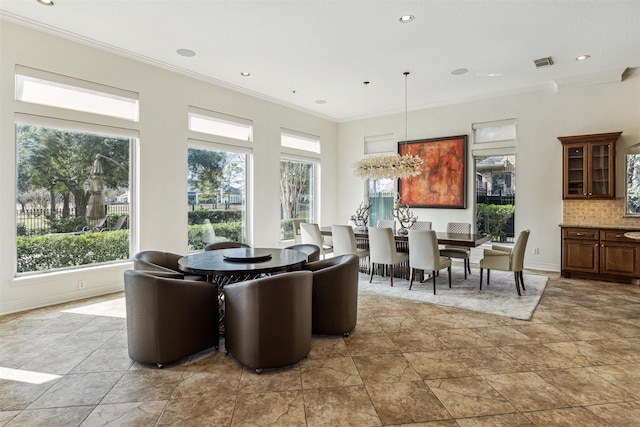 dining room featuring ornamental molding