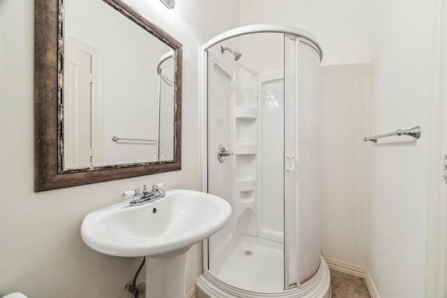 bathroom featuring an enclosed shower