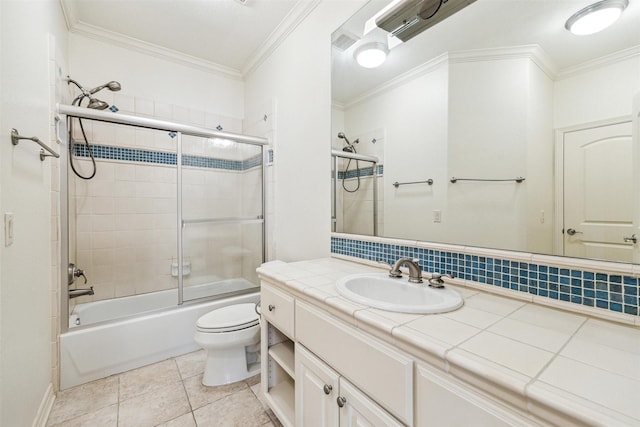 full bathroom featuring bath / shower combo with glass door, ornamental molding, toilet, and vanity