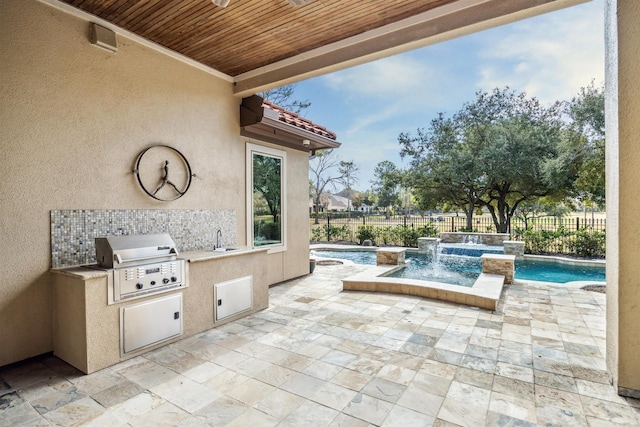 view of patio with a grill, sink, exterior kitchen, pool water feature, and a pool with hot tub