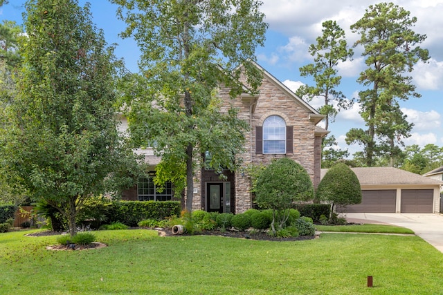 view of front of property featuring a garage and a front yard