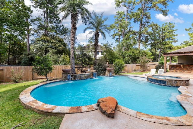 view of pool with an in ground hot tub