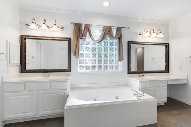 bathroom with crown molding, vanity, and a bathtub