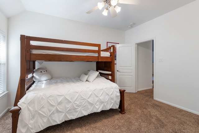 carpeted bedroom featuring ceiling fan, lofted ceiling, and multiple windows