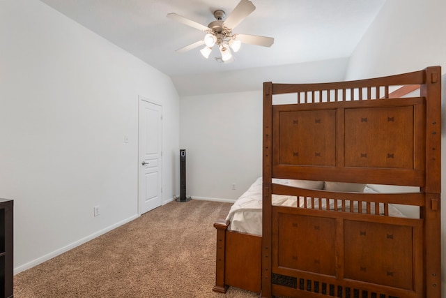 carpeted bedroom featuring vaulted ceiling and ceiling fan