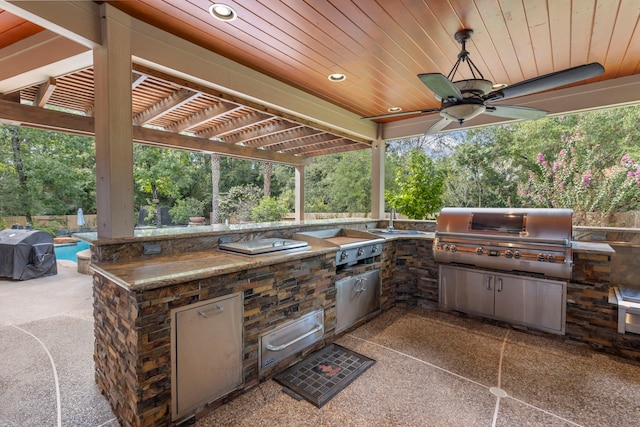 view of patio featuring area for grilling and ceiling fan