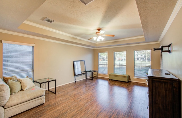 sitting room featuring a raised ceiling, ceiling fan, ornamental molding, and dark hardwood / wood-style flooring