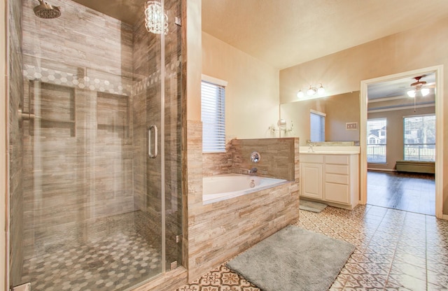 bathroom with vanity, independent shower and bath, and ceiling fan