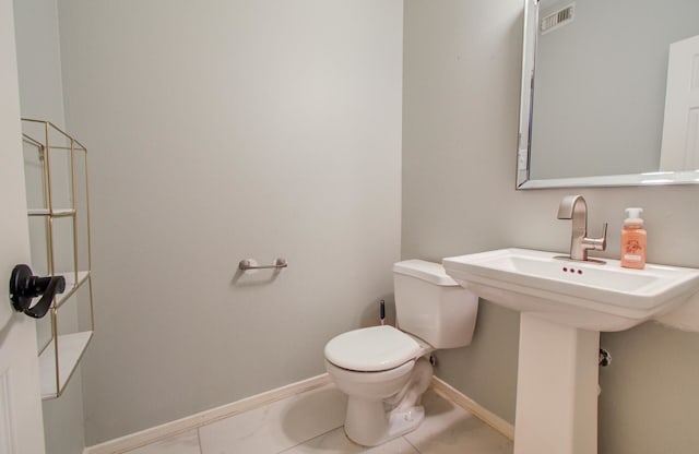 bathroom featuring sink and toilet