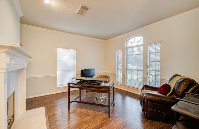 office area with ornamental molding and dark hardwood / wood-style floors