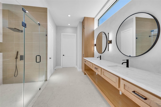 bathroom featuring vanity and an enclosed shower