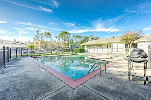 view of pool featuring a patio area