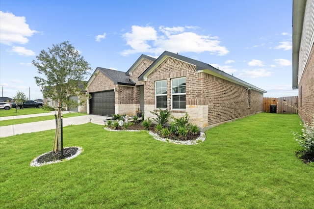 view of front of home with a garage and a front lawn