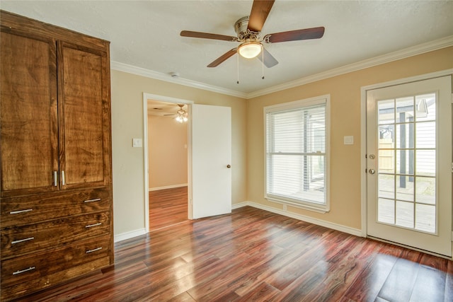 interior space with crown molding, dark hardwood / wood-style floors, and ceiling fan