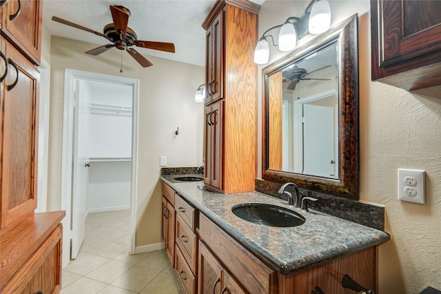 bathroom featuring vanity, tile patterned flooring, and ceiling fan