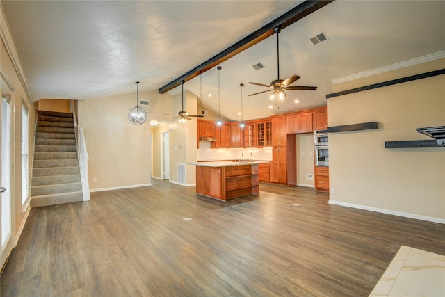 kitchen with a center island, lofted ceiling with beams, dark hardwood / wood-style flooring, pendant lighting, and ceiling fan with notable chandelier