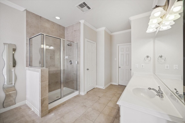 bathroom with a shower with door, vanity, tile patterned flooring, and crown molding