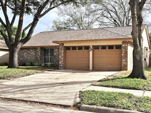 ranch-style home featuring a garage