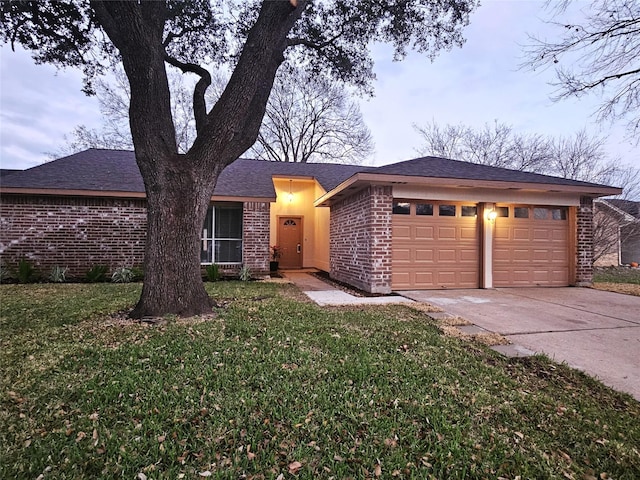 view of front facade with a garage and a front lawn