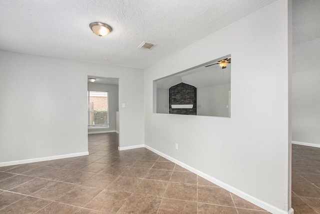 empty room featuring a textured ceiling