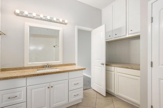 bathroom with tile patterned flooring and vanity