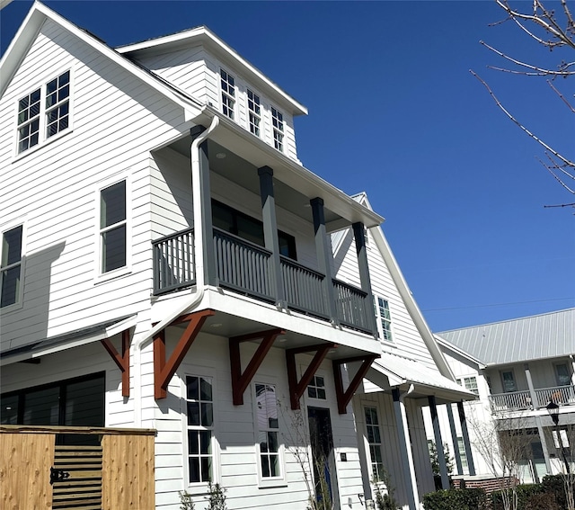 view of front facade with a balcony